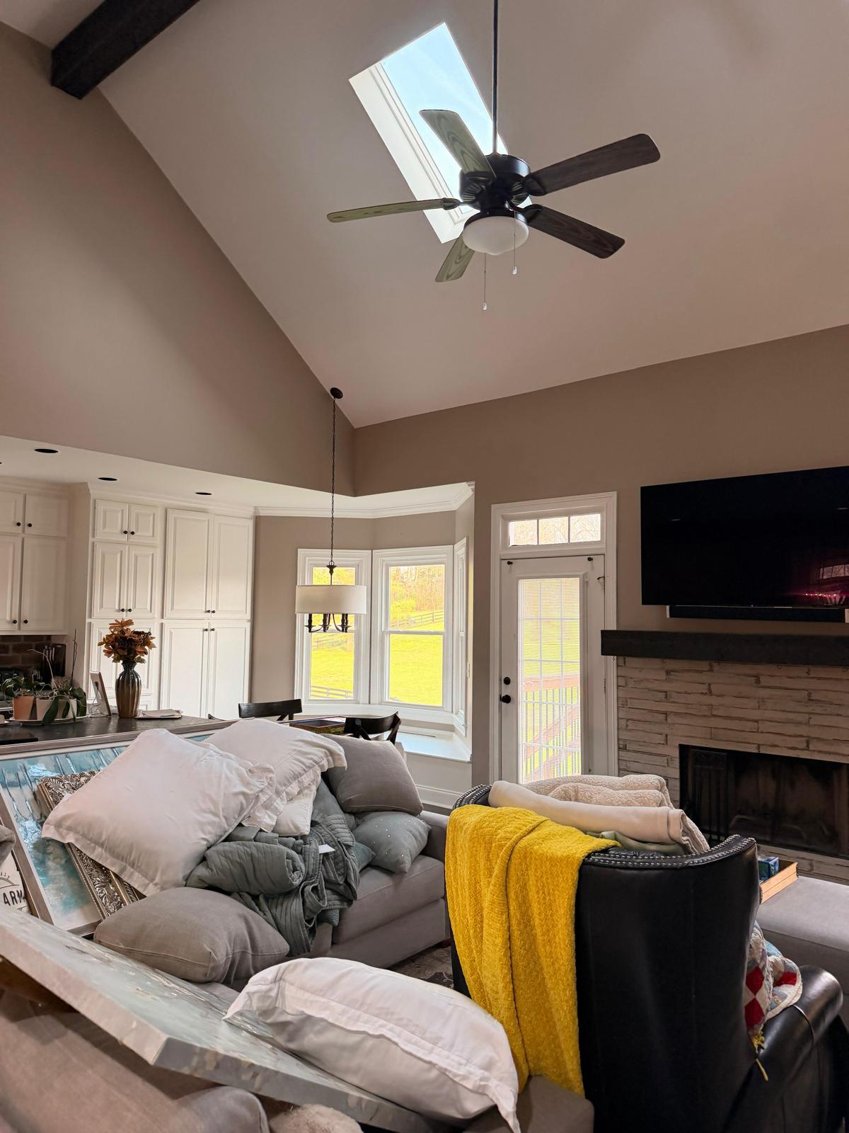 Interior living room with freshly painted walls and vaulted ceiling